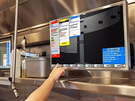 Diner Daddy kitchen display system mounted over a stainless prep line